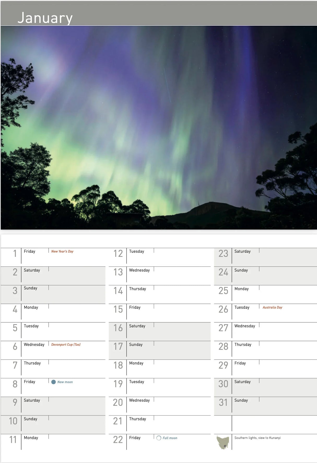 A January calendar page featuring a large photograph of the aurora borealis over a silhouetted hillside, with a grid of dates and day labels below. - Rob Blakers Tasmanian Landscapes Calendar