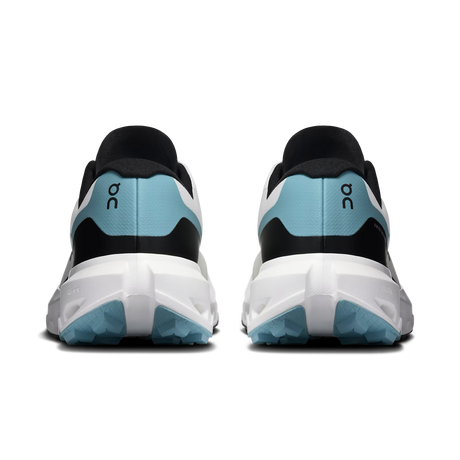 Rear view of a pair of On running shoes in black, white, and light blue, showing the heel counter, logo, and sole details on a white background. - On Cloudvista 3 Shoes (Men's) - Ivory/Wash