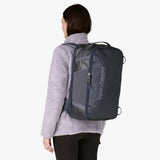 Person wearing a Patagonia backpack on a white background - Patagonia Black Hole Mini MLC Pack 30L - Smolder Blue w/Forge Grey