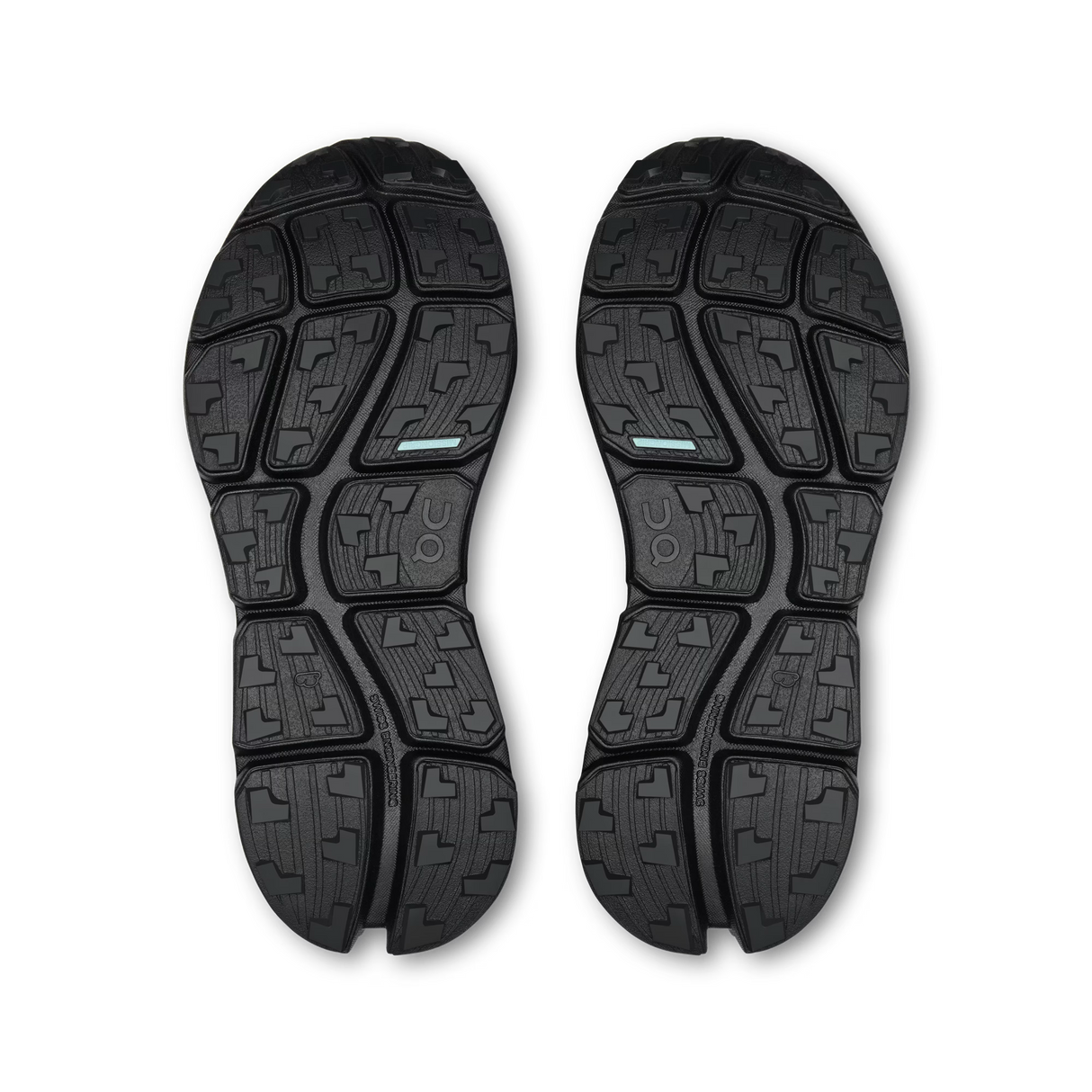 A pair of black athletic shoe soles shown from a top-down view on a white background, featuring a segmented tread pattern with a small light blue accent stripe. - On Cloudsoma Shoes (Women's) - Black/black