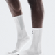 White socks worn with brown pants on a white background - On Performance Run Sock High (Unisex) - White/Glacierbackground