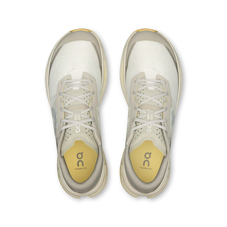 Top-down view of a pair of On running shoes in off-white and light gray with yellow accents on the insoles, shown on a plain white background. - On Cloudultra 3 Shoes (Men's) - Brume/Winter