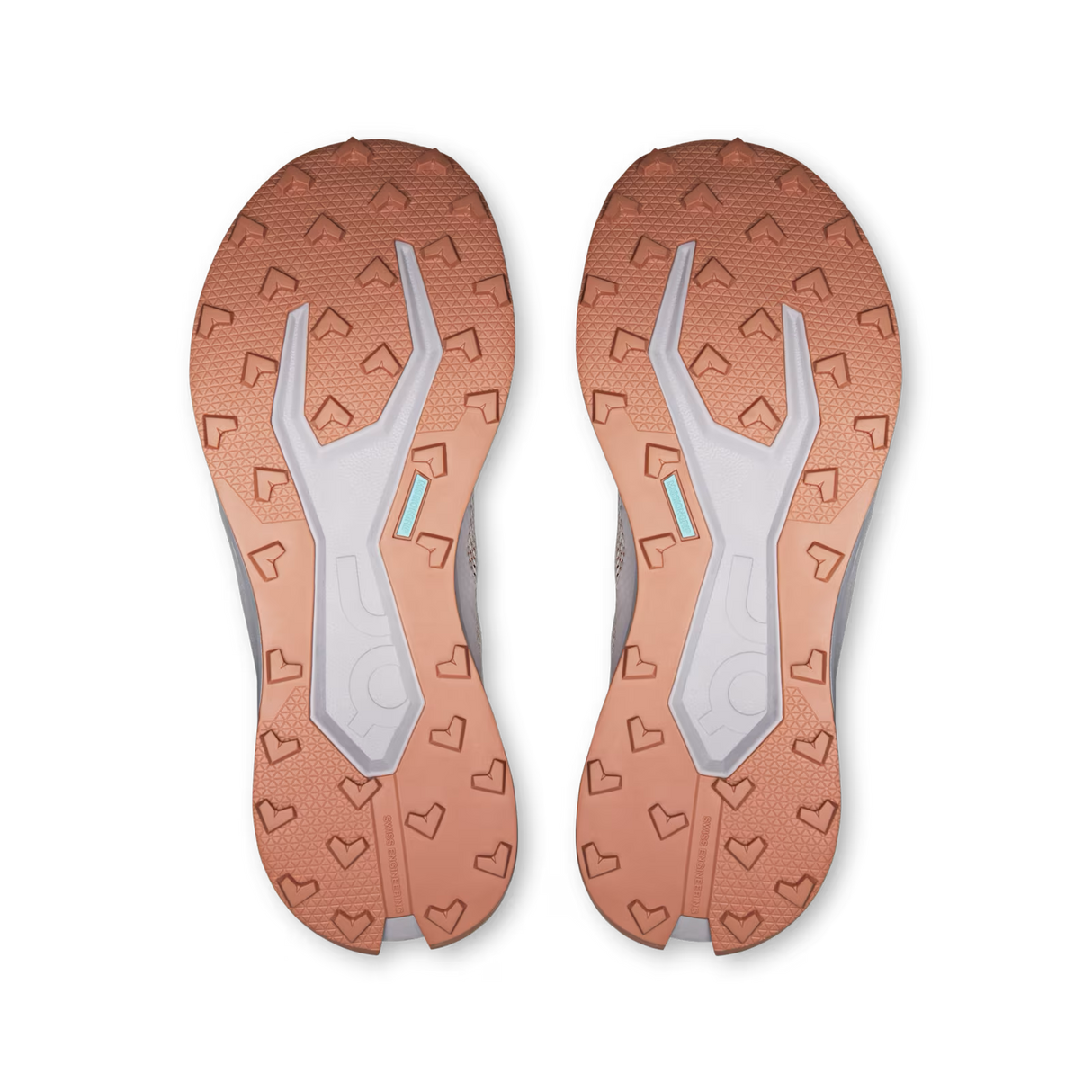 Top-down view of a pair of athletic shoes showing the textured outsoles in a warm copper-orange color with a light gray central tread and small mint-green accents. - On Cloudultra 3 Shoes (Women's) - Oyster/Ether