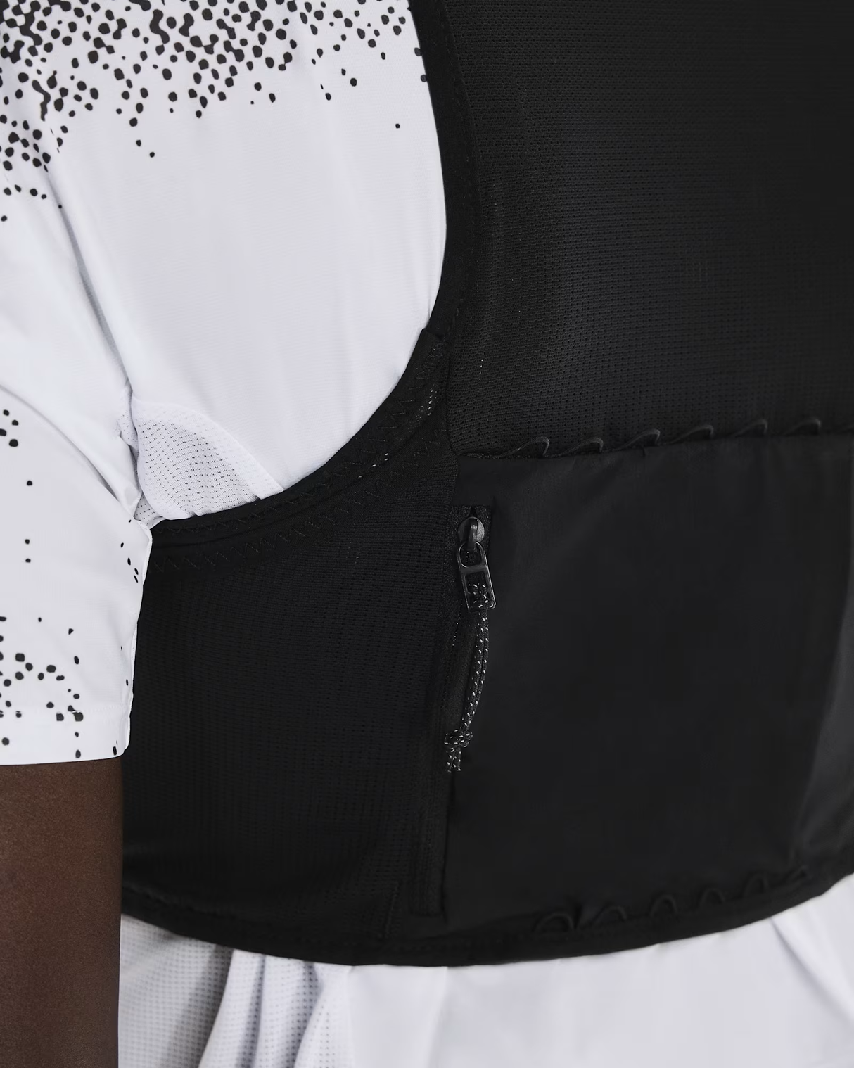 Close-up of a black cycling jersey with a white and black patterned sleeve. - On Ultra Vest Pro (Unisex) - Black