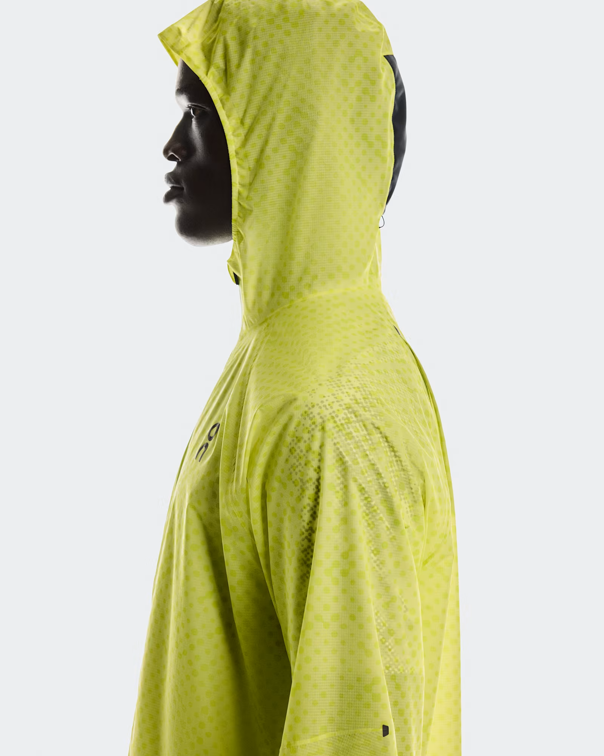 Person wearing a bright green hooded jacket on a white background - On Ultra Jacket (Men's) - Limelight/Lime