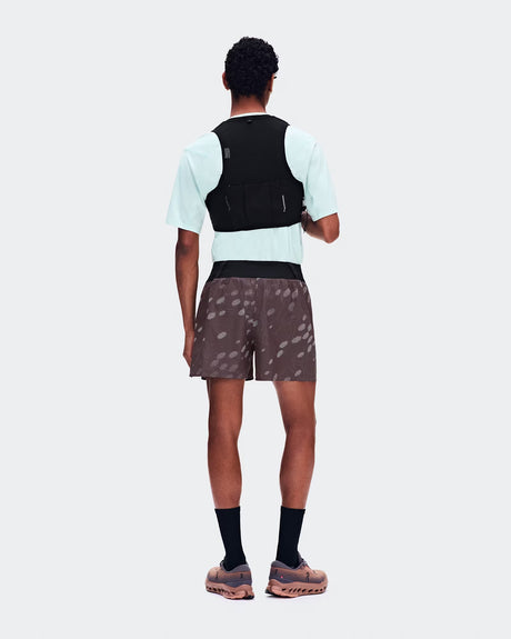 Person wearing a red outfit with cut-out design on a white background - On Trail Shorts (Men's) - Mulberry