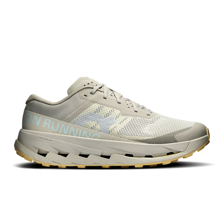 A single running shoe shown in a side profile on a clean white background. The shoe features a light gray and off-white mesh upper with a textured pattern, a thick light gray midsole, and a gum-colored outsole. - On Cloudultra 3 Shoes (Men's) - Brume/Winter