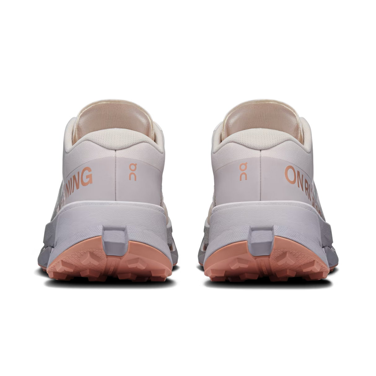 A pair of On Running trail shoes shown from the rear, featuring a light gray and off-white upper, peach-colored outsole, and peach branding text on a clean white background. - On Cloudultra 3 Shoes (Women's) - Oyster/Ether