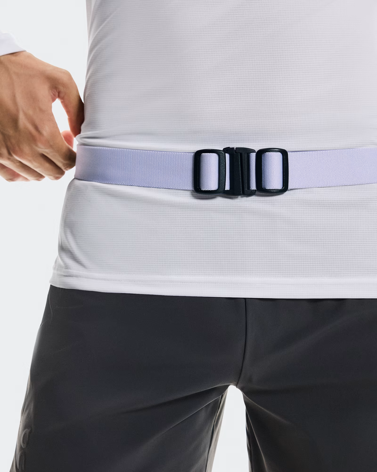 Person wearing a light gray belt with a black buckle on a plain background - On Speed Belt (Unisex) - Thistle