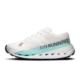 A white On Running shoe with a light blue midsole accent and black branding text, shown in a side profile on a white background. - On Cloudultra Pro Shoes (Women's) - Ivory/Celeste