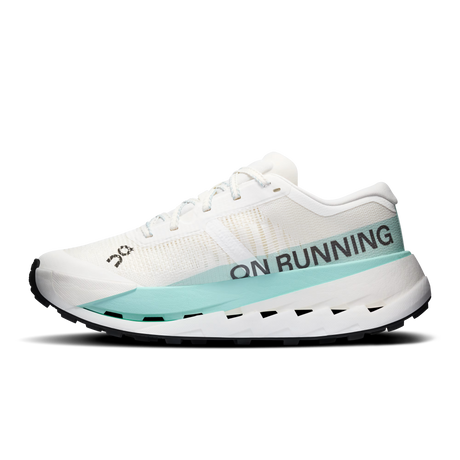 A white On Running shoe with a light blue midsole accent and black branding text, shown in a side profile on a white background. - On Cloudultra Pro Shoes (Women's) - Ivory/Celeste