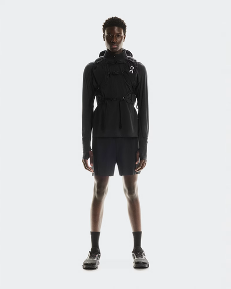 Person wearing a black outfit with a hood on a white background - On Trail Pack 20L - Black
