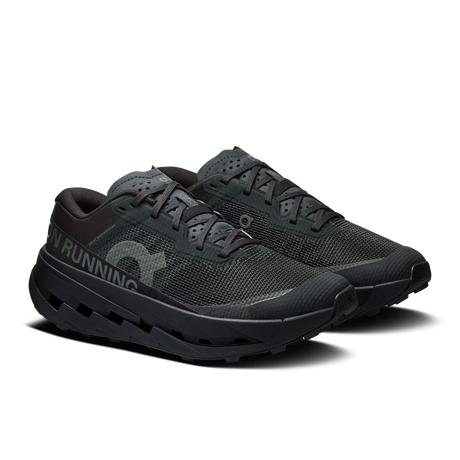 Black running shoes with visible brand logo on a white background - Black/Black