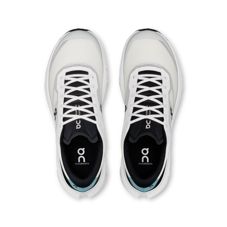 A pair of On Cloudcotta running shoes shown from a top-down view, featuring a white and black design with a subtle light blue accent near the heel. - On Cloudvista 3 Shoes (Men's) - Ivory/Wash
