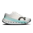 A white On running shoe with a light blue midsole accent and a dark gray textured circular logo on the side, shown against a plain white background. - On Cloudultra Pro Shoes (Women's) - Ivory/Celeste