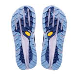 The outsoles of a pair of trail running shoes, showing a light blue and navy tread pattern with a small yellow Vibram logo on each side, isolated on a white background. - Altra Olympus 7 Shoes (Women's) - Rain Washed/Oceana