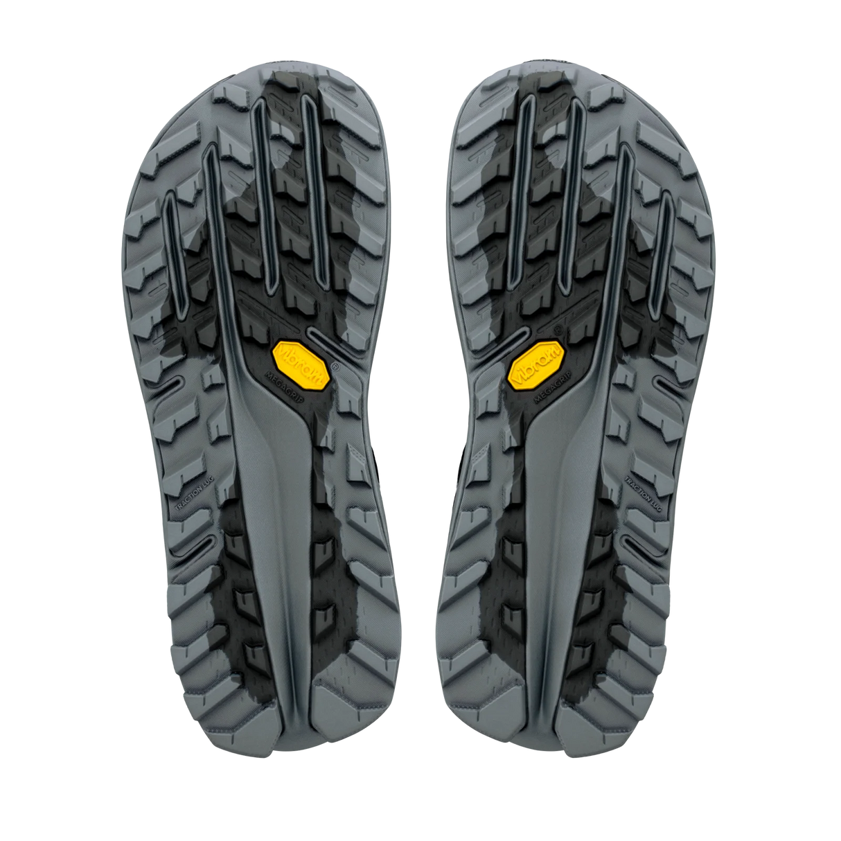 A pair of rugged hiking shoe soles shown from the bottom, featuring a dark gray and black tread pattern with small yellow Vibram logos. - Altra Olympus 7 Shoes (Women's) - Black/Silver/Castlerock