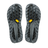 A pair of rugged hiking shoe soles shown from the bottom, featuring a dark gray and black tread pattern with small yellow Vibram logos. - Altra Olympus 7 Shoes (Women's) - Black/Silver/Castlerock