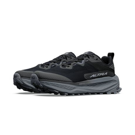 A pair of black and dark gray trail running shoes with a thick cushioned sole, shown from a side profile view on a white background. - Altra Olympus 7 Shoes (Women's) - Black/Silver/Castlerock