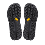A pair of black rugged outdoor shoe soles shown from the bottom, featuring deep lugs and small yellow Vibram logos near the rear. - Altra Olympus 7 Hike Mid GORE-TEX Boots (Men's) - Black/Shadow