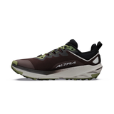 A single ALTRA trail running shoe shown in a side profile view against a plain white background. The shoe features a dark brown and black upper with olive green accents on the laces, toe cap, and midsole, and a thick white and gray cushioned sole. - Altra Experience Wild 3+ Shoes (Men's) - Chocolate/Torte