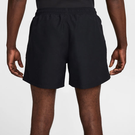 Rear view of a person wearing black athletic shorts against a light gray studio background. - Nike ACG Reservoir Goat Shorts (Men's) - Black/Anthracite/Summit White