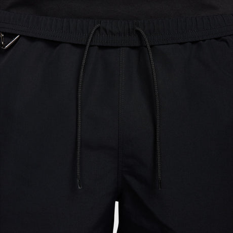 Close-up of black drawstring shorts showing the elastic waistband and drawstrings. - Nike ACG Reservoir Goat Shorts (Men's) - Black/Anthracite/Summit White