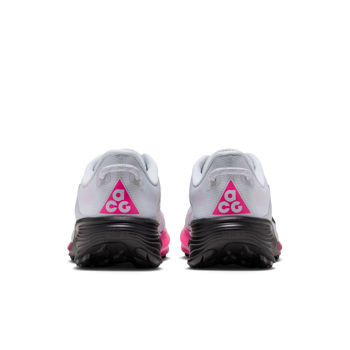 A pair of white and gray trail running shoes shown from the back, featuring a bright pink ACG logo triangle on the heel and a thick black midsole. - Nike ACG Pegasus Trail Shoes (Men's) - Pure Platinum/Black-Hyper Pink