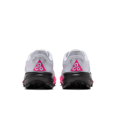 A pair of white and gray trail running shoes shown from the back, featuring a bright pink ACG logo triangle on the heel and a thick black midsole. - Nike ACG Pegasus Trail Shoes (Men's) - Pure Platinum/Black-Hyper Pink