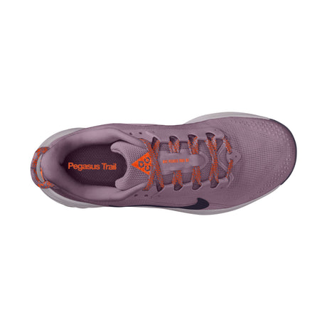 A top-down view of a Nike Pegasus Trail running shoe in a dusty purple colorway with bright orange accents on the laces and heel, and a black Swoosh logo. - Nike ACG Pegasus Trail Shoes (Women's) - Violet Dust/Purple Dynasty-Safety Orange