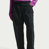 Black pants with a visible brand logo on a light gray background - Nike ACG Dolomiti Pants (Women's) - Black/Summit White