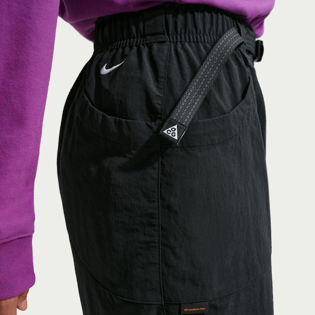 Black pants with a brand logo on a white background - Nike ACG Dolomiti Pants (Women's) - Black/Summit White