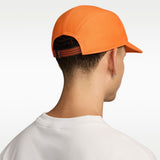 A man shown from the back wearing a bright orange baseball cap with a black and orange patterned back strap, paired with a white t-shirt against a clean white background. - Nike ACG Fly Unstructured Cap - Safety Orange/Safety Orange