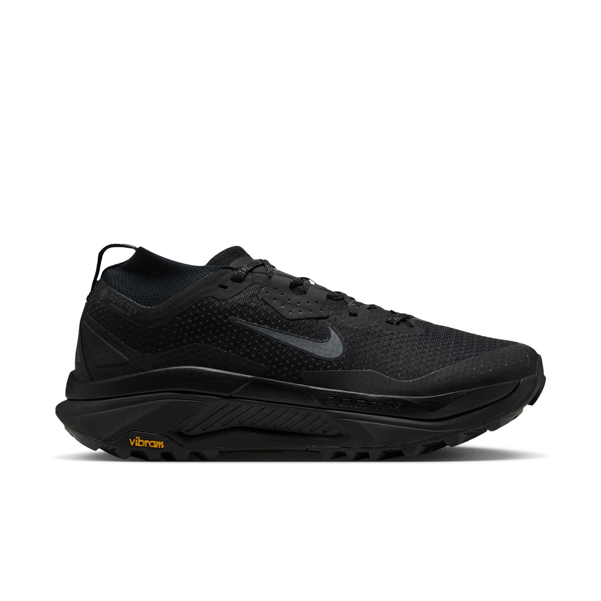 A black Nike running shoe with a textured mesh upper, a dark gray Swoosh logo, and a black Vibram outsole, shown in a side profile on a white background. - Nike ACG Zegama Trail GORE-TEX Shoes (Men's) - Black/Anthracite