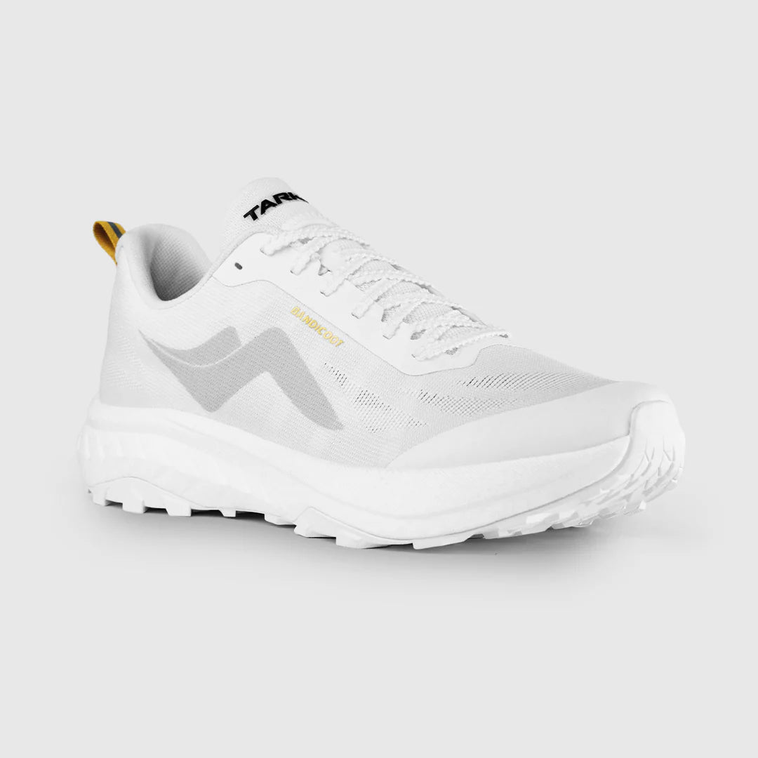 A white trail running shoe with a light gray side logo, white laces, a small gold 'TRAILRUN' text detail, and a gold pull tab, shown on a light gray background. - Tarkine Bandicoot Shoes (Women's) - Whiteout