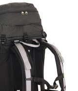 Close-up of the back of a black hiking backpack with gray padded shoulder straps and mesh ventilation panels, shown on a white background. - One Planet Extrovert 55L Pack - Black