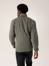 Person wearing a green jacket with a visible brand logo on a light gray background - Arc'teryx Atom Jacket (Men's) - Forage