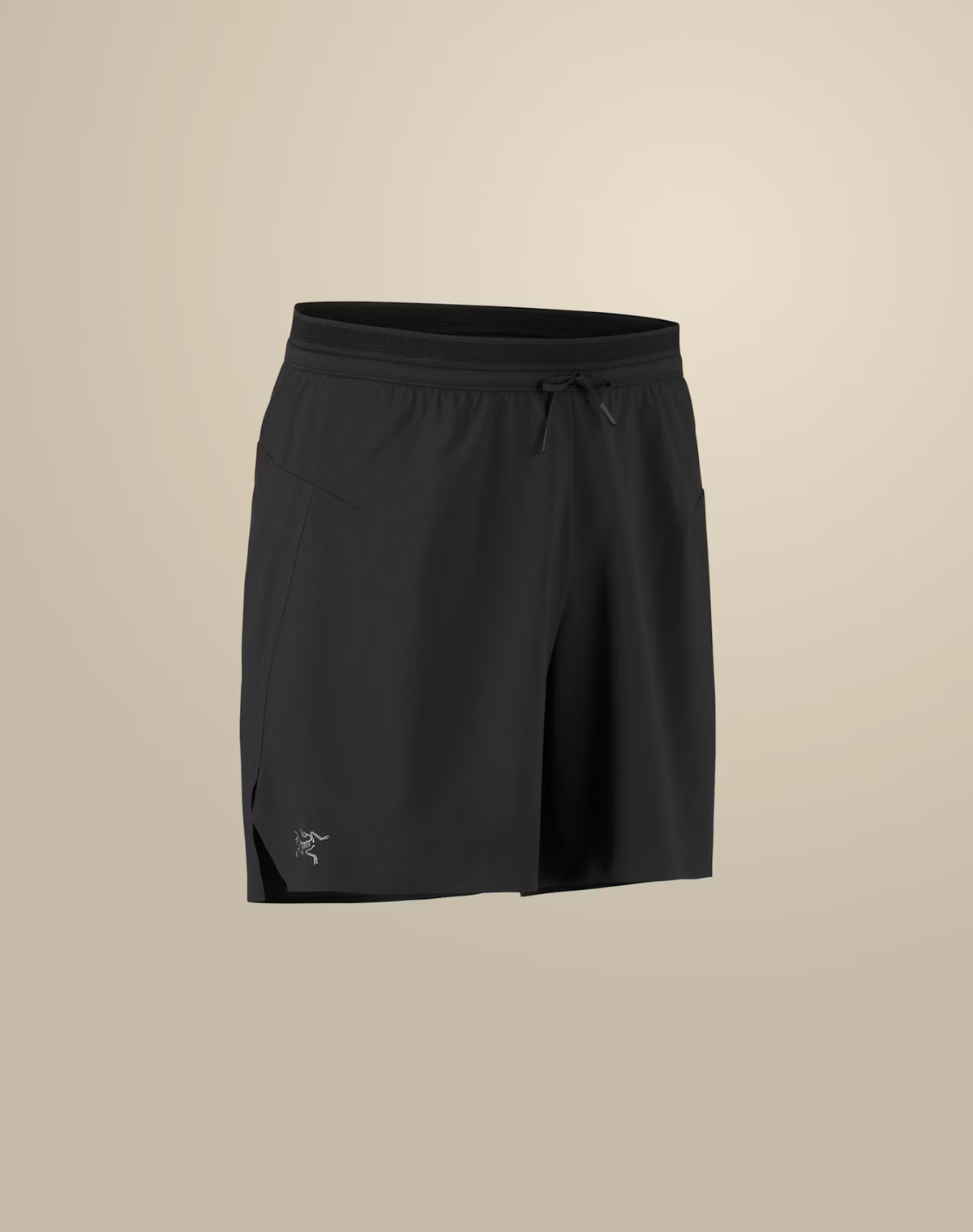 Black athletic shorts with an elastic drawstring waistband and a small white Arc'teryx logo on the lower left hem, shown against a solid beige background. - Arc'teryx Norvan Liner Shorts 7" (Men's) - Black