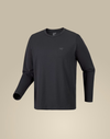 A dark charcoal gray long-sleeve crewneck shirt with a small tonal Arc'teryx logo on the left chest, displayed on a neutral beige background. - Arc'teryx Cormac Crew Neck Shirt Long Sleeve (Men's) - Black