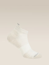 White ankle sock on a beige background - Icebreaker Merino Multisport Light Micro Socks (Men's) - Ecru Heather/Alloy/Snow