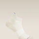 White ankle sock on a beige background - Icebreaker Merino Multisport Light Micro Socks (Men's) - Ecru Heather/Alloy/Snow