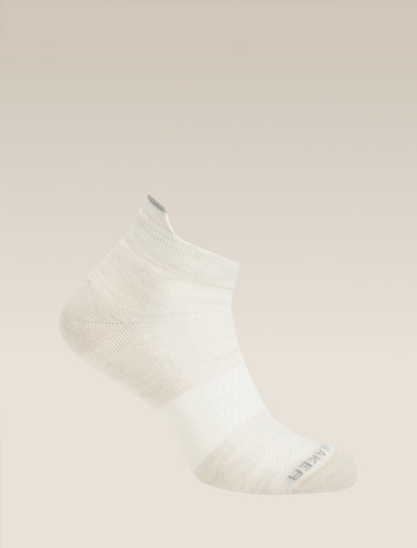 White ankle sock on a beige background - Icebreaker Merino Multisport Light Micro Socks (Men's) - Ecru Heather/Alloy/Snow