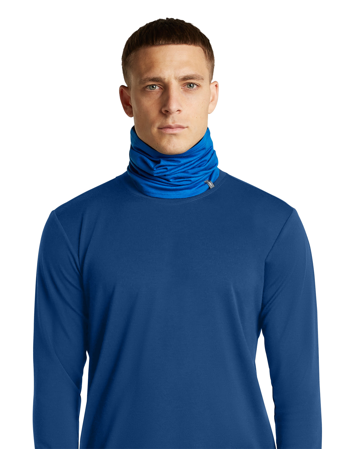 A man wearing a royal blue long-sleeve athletic top with a high folded mock neck and a matching blue neck gaiter, shown against a plain white background. - Icebreaker Merino 200 Flexi Chute (Unisex) - Lazurite