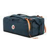 Blue duffel bag with orange straps on a white background - Fjällräven Färden Duffel 80L - Navy