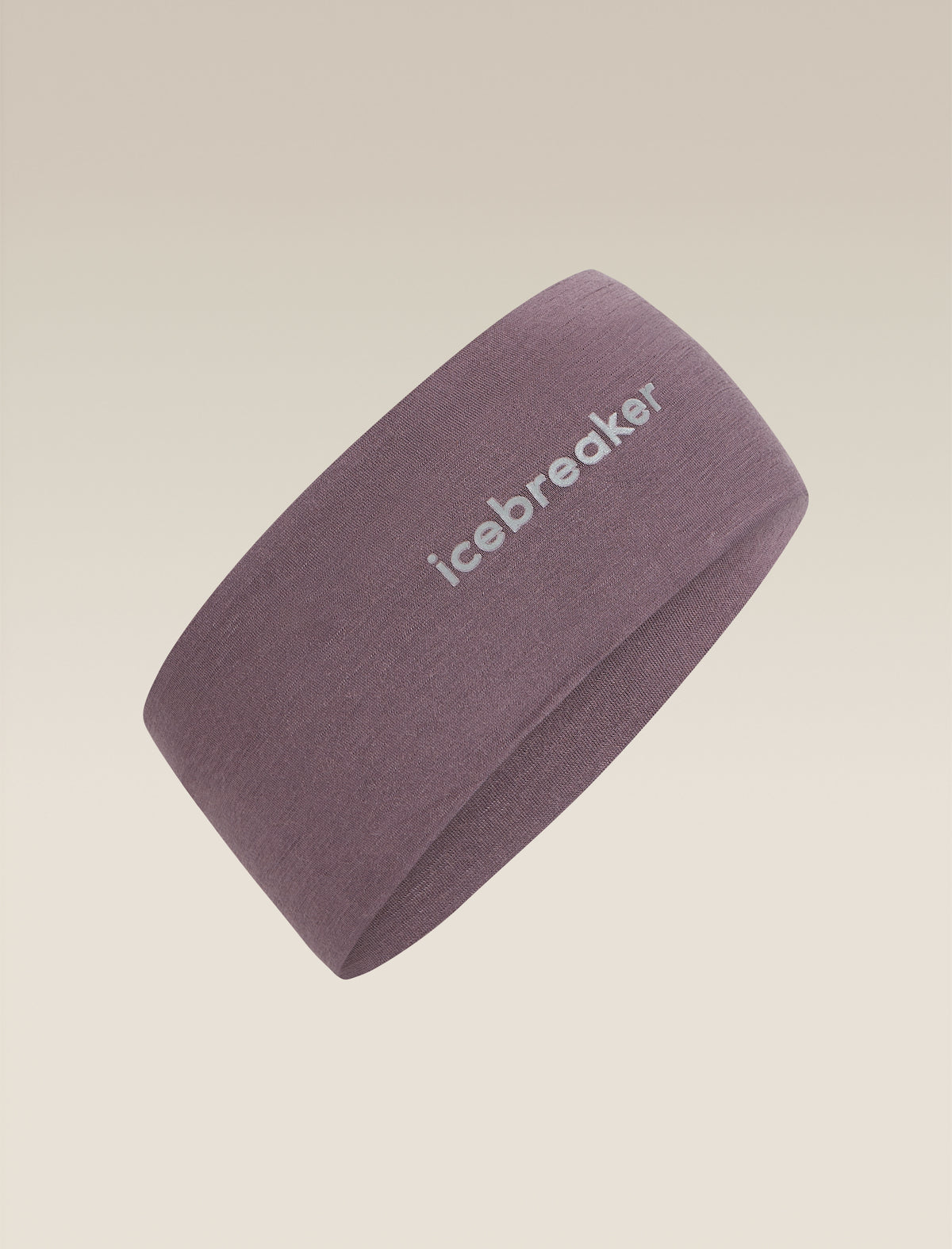 A dusty purple athletic headband with the brand name 'icebreaker' printed in white on the side, shown against a solid beige background. - Icebreaker Merino 200 Oasis Headband (Unisex) - Grey Plum