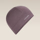 A single knit beanie hat in a muted dusty purple color, featuring the white 'icebreaker' logo on the side, set against a solid light beige background. - Icebreaker Merino 200 Oasis Beanie (Unisex) - Grey Plum