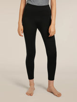 Person wearing black leggings on a beige background - Icebreaker Merino 260 Fastray 25" High Rise Tights (Women's) - Black