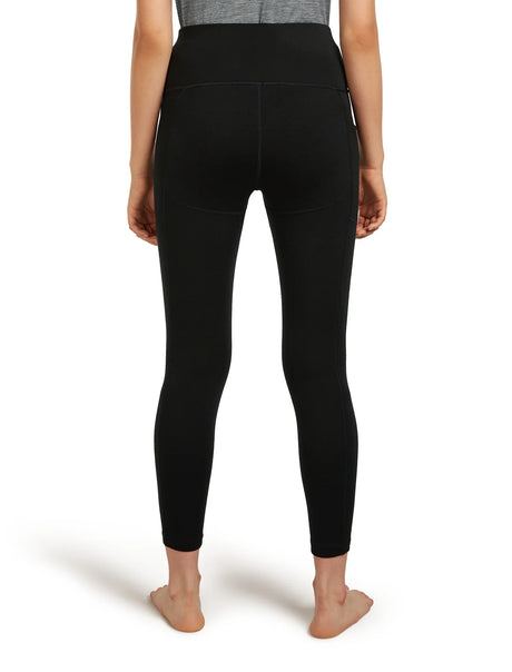 Person wearing black leggings on a white background - Icebreaker Merino 260 Fastray 25" High Rise Tights (Women's) - Black