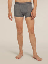 A man wearing heather gray boxer briefs with a dark gray waistband featuring the 'lebrecher' brand logo, shown from the waist down against a light beige studio background. - Icebreaker Merino Blend 125 Cool-Lite Anatomica Boxers (Men's) - Gritstone Heather