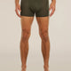 A man wearing dark olive green boxer briefs, shown from the waist down against a plain light beige studio background. - Icebreaker Merino Blend 125 Cool-Lite Anatomica Boxers (Men's) - Dark Loden
